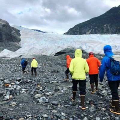 a group of people standing on top of a mountain